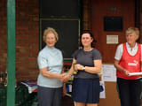 A woman being given an award