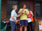 A woman being given an award