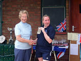 A woman being given an award