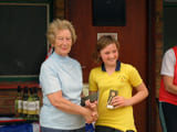 A woman being given an award