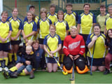 A team posing infront of a goal